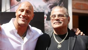 HOLLYWOOD, CA - MAY 19:  Dwayne "The Rock" Johnson (C) and his mom and dad at the hand/footprint ceremony honoring him held at TCL Chinese Theatre IMAX on May 19, 2015 in Hollywood, California.  (Photo by Michael Tran/FilmMagic)
