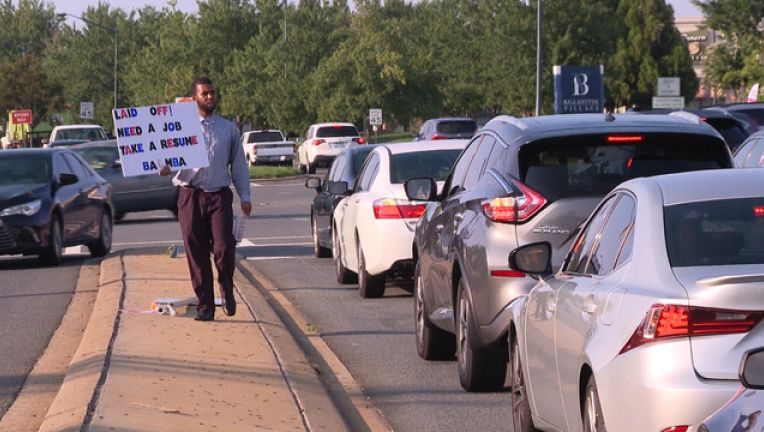 Laid Off Father Of 2 With A MBA Passes Out His Resume On A Busy NC Intersection