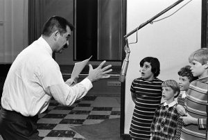 Producer Lee Mendelson directs children who are recording the dialogue for the animated TV special "It's the Great Pumpkin, Charlie Brown", featuring the characters from Charles Schultz's comic strip "Peanuts". (Photo by © Ted Streshinsky/CORBIS/Corbis via Getty Images)