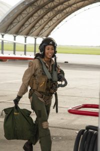 200707-N-OT909-1086 KINGSVILLE, Texas (July 7, 2020) Student Naval Aviator Lt. j.g. Madeline Swegle, assigned to the Redhawks of Training Squadron (VT) 21 at Naval Air Station Kingsville, Texas, exits a T-45C Goshawk training aircraft following her final flight to complete the undergraduate Tactical Air (Strike) pilot training syllabus, July 7, 2020. Swegle is the U.S. Navy's first known Black female strike aviator and will receive her Wings of Gold during a ceremony July 31. (U.S. Navy photo by Anne Owens/Released)